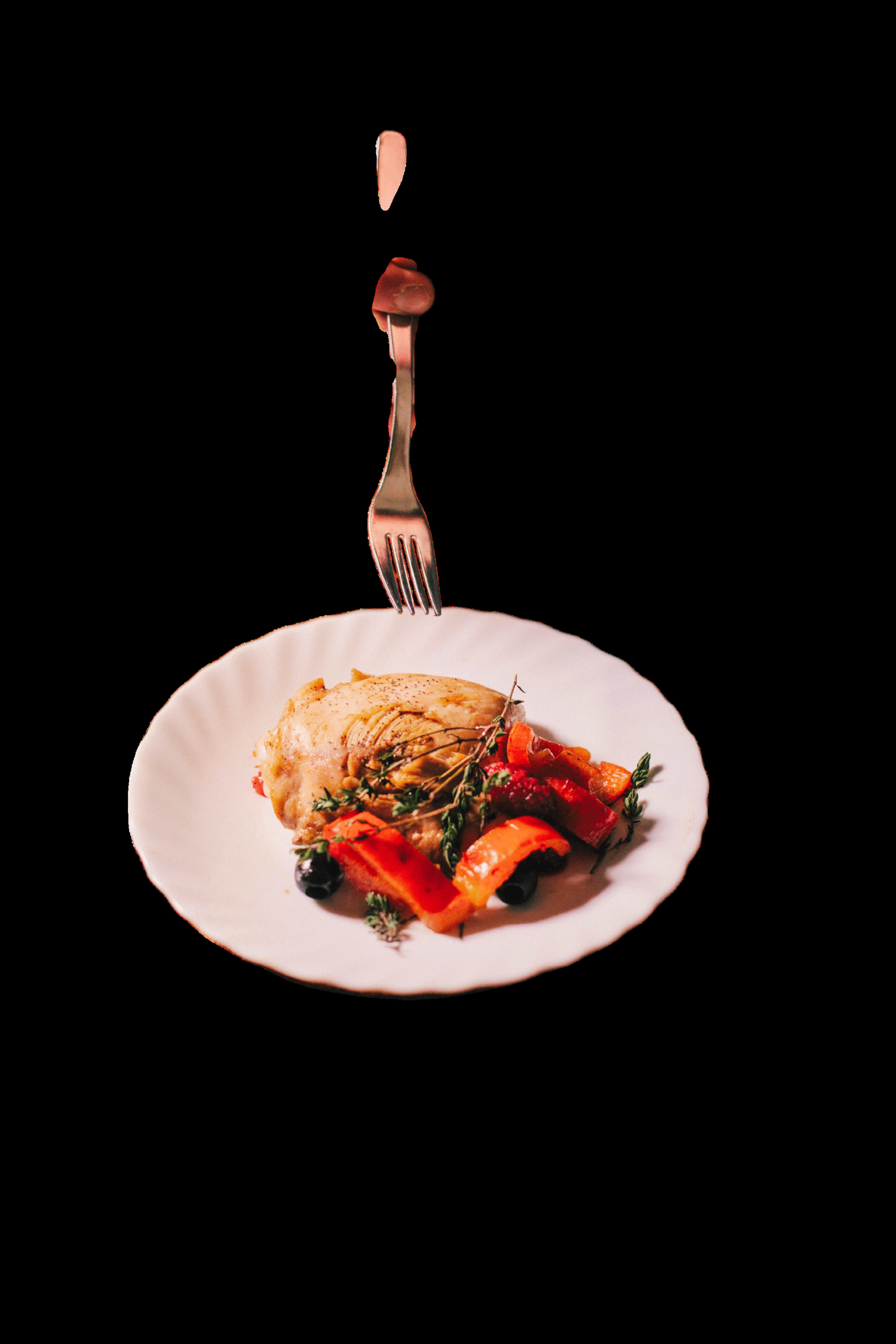 A plated dish held aloft on a fork